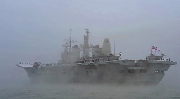 HMS Ark Royal flies her decommissioning pennant as she enters Portsmouth for the last time. Credit: MoD