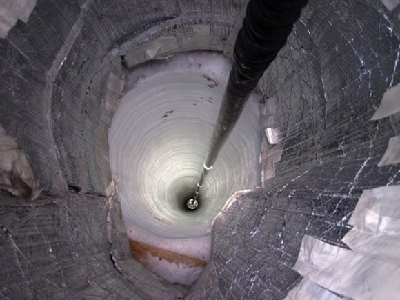 Sensor descends down a hole in the ice as part of the final season of IceCube. Credit: NSF/B Gudbjartsson