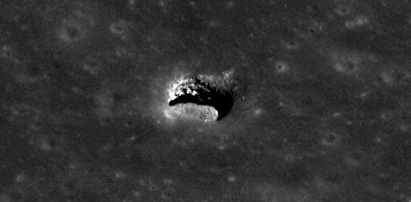 Oblique view of the Marius Hills pit with just the right angle to reveal an overhang. Pit is about 65 meters in diameter. Credit: NASA/GSFC/Arizona State University