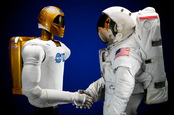 Robonaut shakes hands with with his human counterpart. Pic: NASA