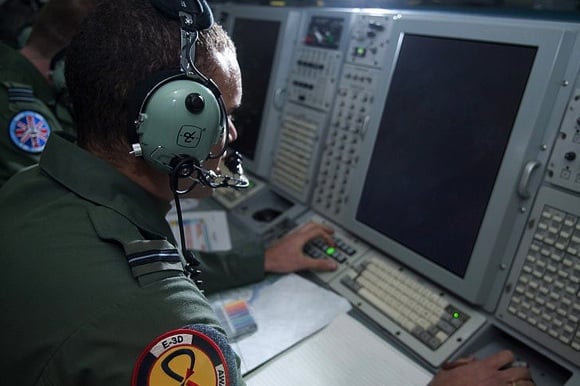 A crewman aboard an RAF E-3D AWACS plane monitors the air picture over Libya. Credit: Crown Copyright/SAC Andy Stevens