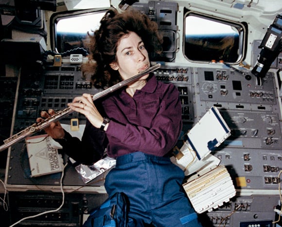 Ellen Ochoa plays the flute in space shuttle Discovery's aft flight deck in April 1993. Pic: NASA