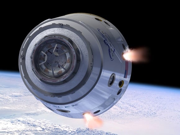 The Dragon capsule with 'Draco' rockets in action. Credit: SpaceX