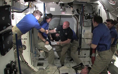 Endeavour crew welcomed aboard the ISS. Pic: NASA TV