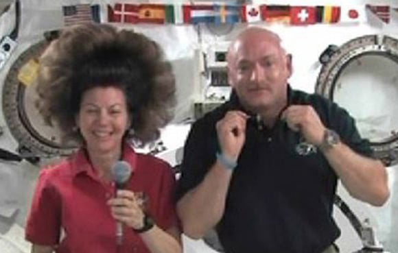 Cady Coleman's unfettered zero-grav hairstyle seen in during an interview with Endeavour commander Mark Kelly. Pic: NASA TV