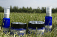 Neal's Yard jars and spray in field