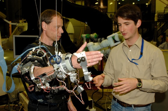 ESA astronaut Christer Fuglesang works with Exoskeleton in the robotics lab at ESTEC. Credit: ESA/J van Haarlem