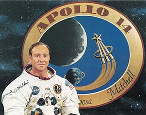 Edgar Mitchell with the Apollo 14 logo