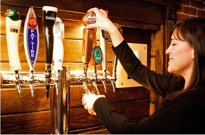 Customer pouring their own beer