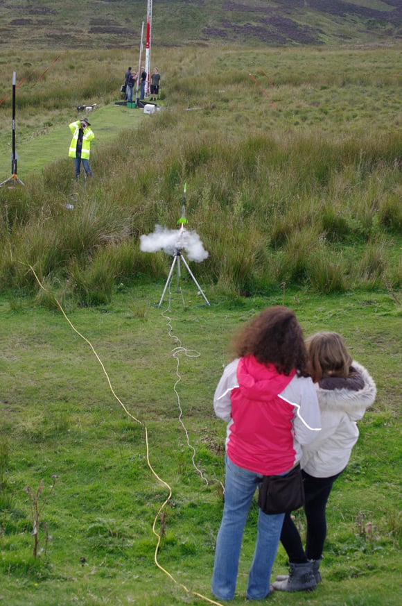 A mother and daughter team launch a rocket