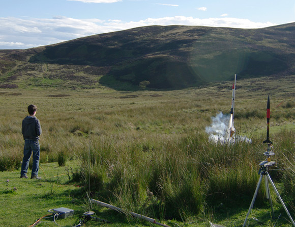 A young lad launches a rocket