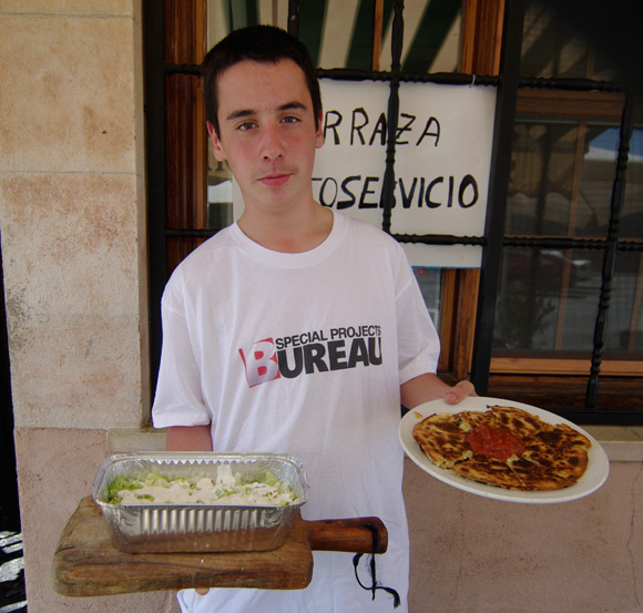 Our waiter Andres bearing a quesadilla and a portion of kapsalon