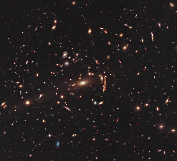 Hubble photo showing gravitational lensing warping the appearance of the galaxy cluster MACS J1206.2-0847