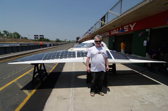 Drew poses in front of Durham Uni's solar car