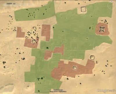 Satellite image of desert with archaeological interpretation of features: fortifications in black, dwellings in red and gardens in green. Credit: Copyright 2011 Google, image copyright 2011 DigitalGlobe