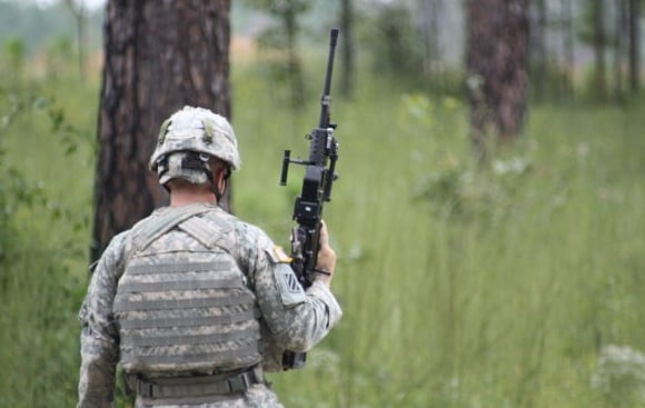 Specialist Brandon Smith carries the LSAT LMG one-handed. Credit: US Army