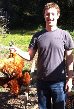 Mark Zuckerberg with a chicken he just killed