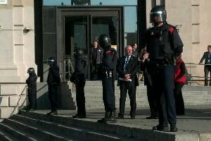 Riot police lined up outside the venue