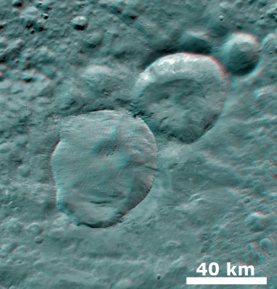3-D anaglyph shows the ‘Snowman’ craters on asteroid Vesta. Credit: NASA/JPL-Caltech/UCLA/MPS/DLR/IDA