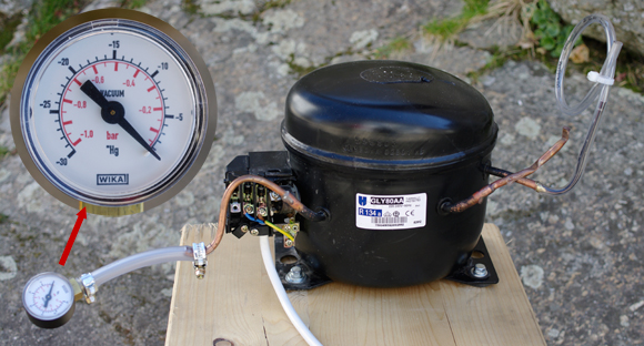 Our fridge compressor connected to a vacuum gauge