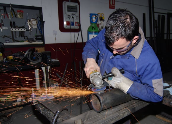 Antonio grinding the welds of the REHAB chamber