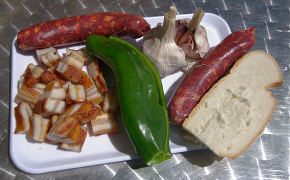 Panceta, chorizo, pepper, garlic and bread - the basic ingredients of migas