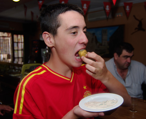 Andres tucks into haggis pakora