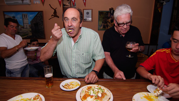 Fernando tucking into huevos rancheros