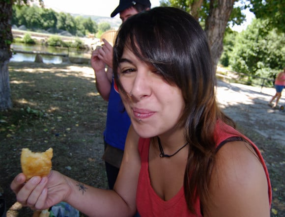 A young lady enjoys pierogi