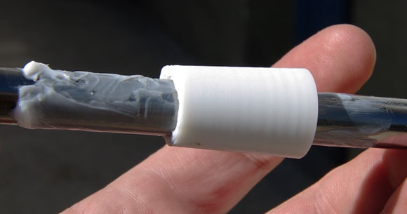 The Teflon insert mounted on the tube, with Molykote 33 grease