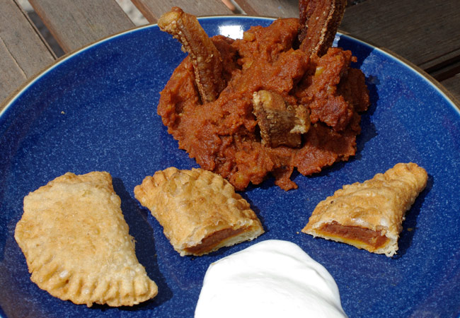 The finished paprika potato pierogi, with sour cream and patatas revolconas