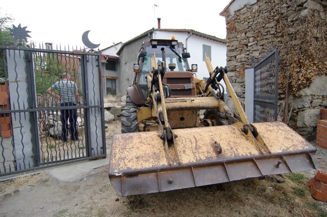 Ramon and the excavator trundle through the gates