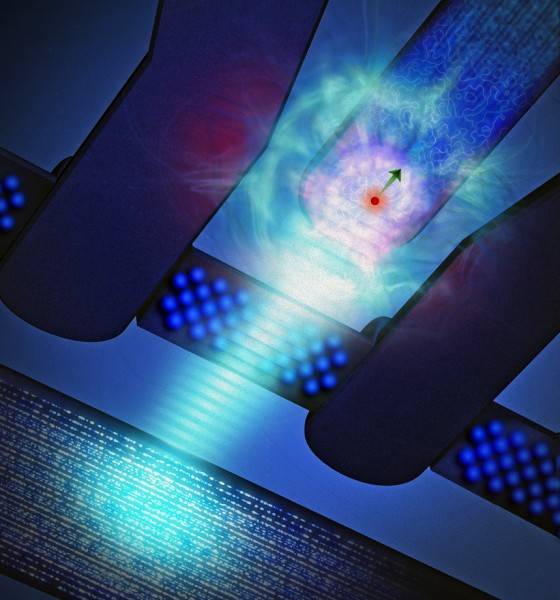 Artist’s impression of a phosphorus atom (red sphere surrounded by electron “cloud”, with arrow showing the spin direction) coupled to a silicon single-electron transistor. A burst of microwave radiation (light blue) is used to ‘write’ information on the electron spin. Credit: Tony Melov