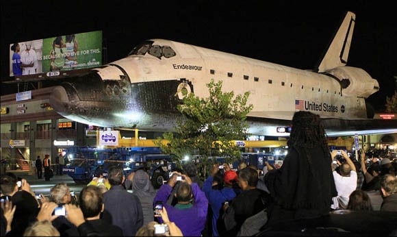 The Space Shuttle Endeavour being trucked through the streets of Los Angeles