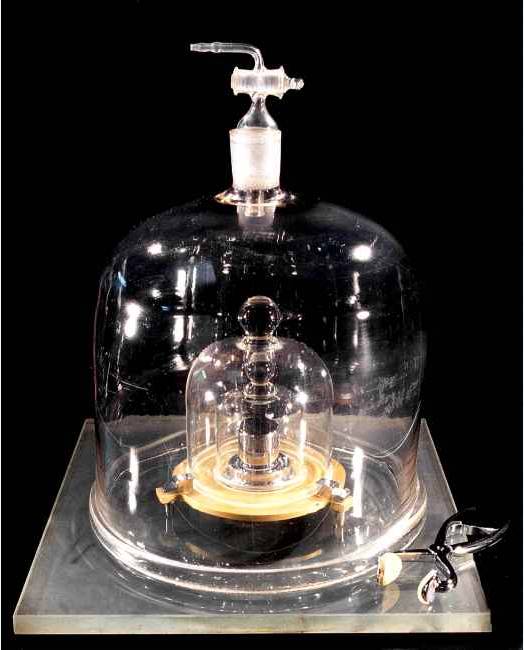 The kilogram mass with bell jars