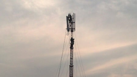 Engineers fitting antenna heads