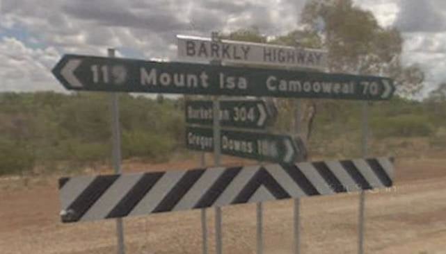Signs on the Barkly Highway showing the way to Mount Isa