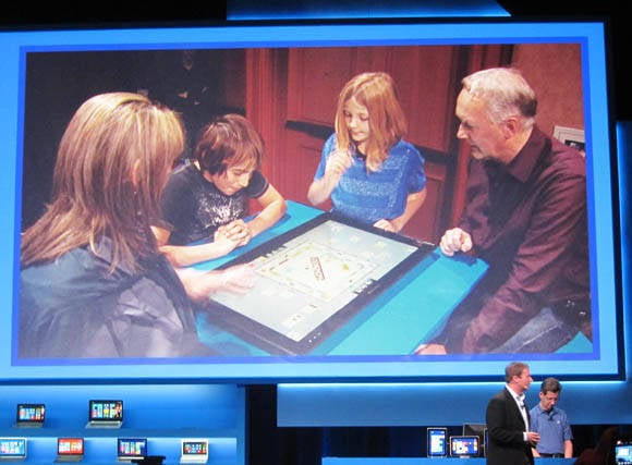 Intel envisions a family playing digital Monopoly on a 27-inch all-in-on PC lying flat on its back on the kitchen table