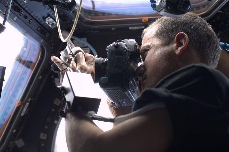 Astronaut Chris Hadfield taking photos on the ISS