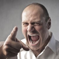 A man shouting angrily