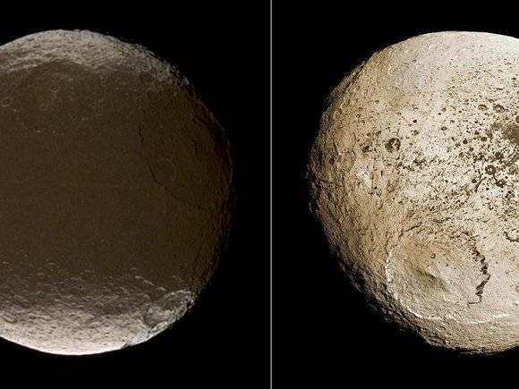 Extreme brightness dichotomy on the surface of Saturn moon Iapetus