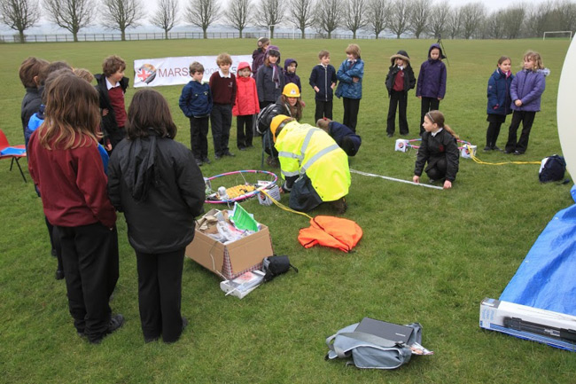 SEA operatives prep the mission while schoolkids look on. Pic: SEA