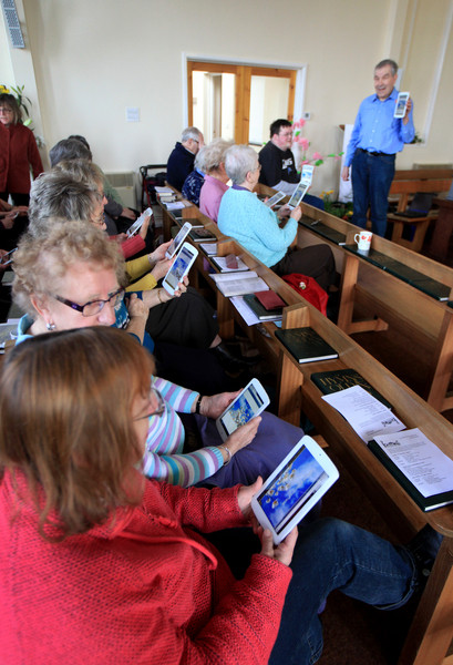 Elderly church-goers embracing tablet technology