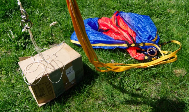The parachute, cardboard payload box, rigging and igniter lines