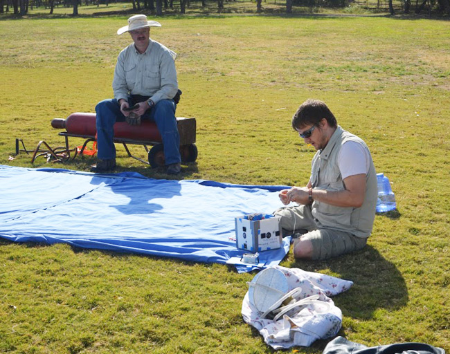 Caleb prepares the payload at the launch site