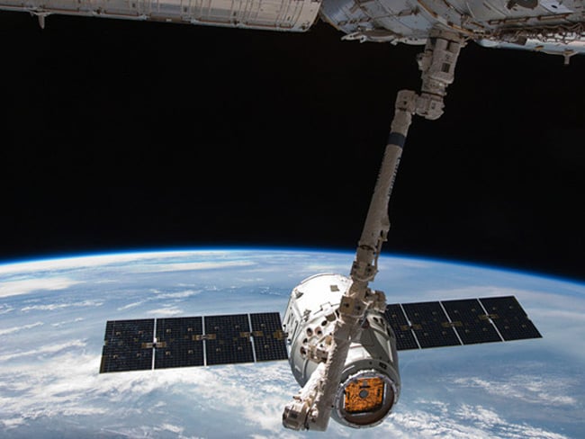 The Dragon spacecraft docks with the ISS. Pic: NASA