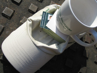 Lehman mug and hat left on the ground