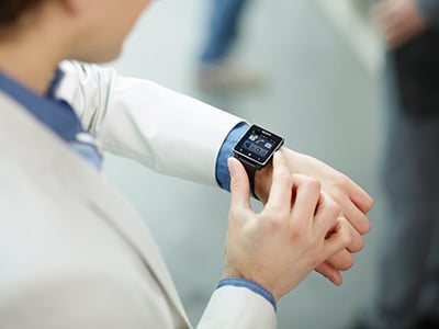 Sony SmartWatch on a cream suit