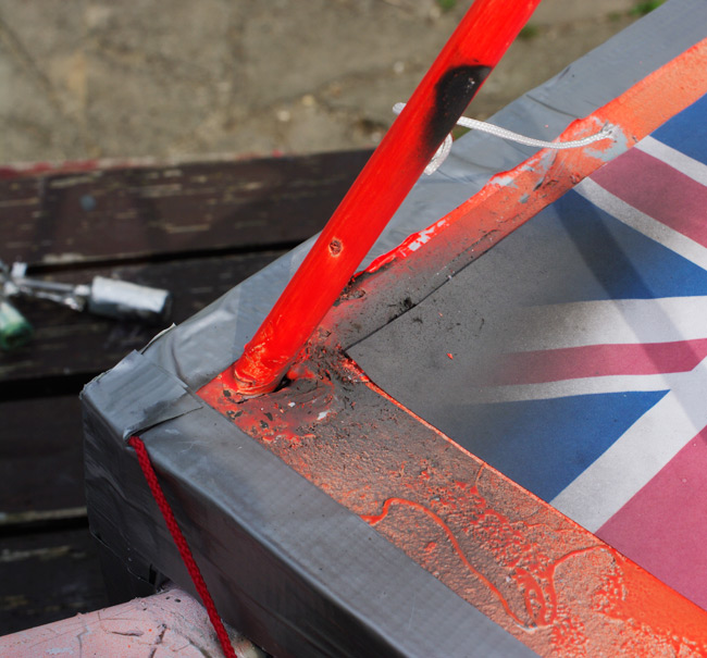 The scorching on the top of the payload box, caused by the igniter