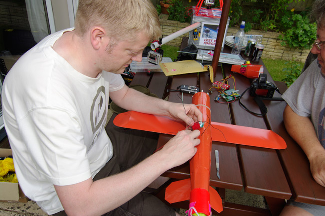 Anthony inserts a tracker in the CHAV's fuselage